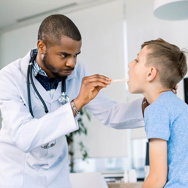 Doctor examining child